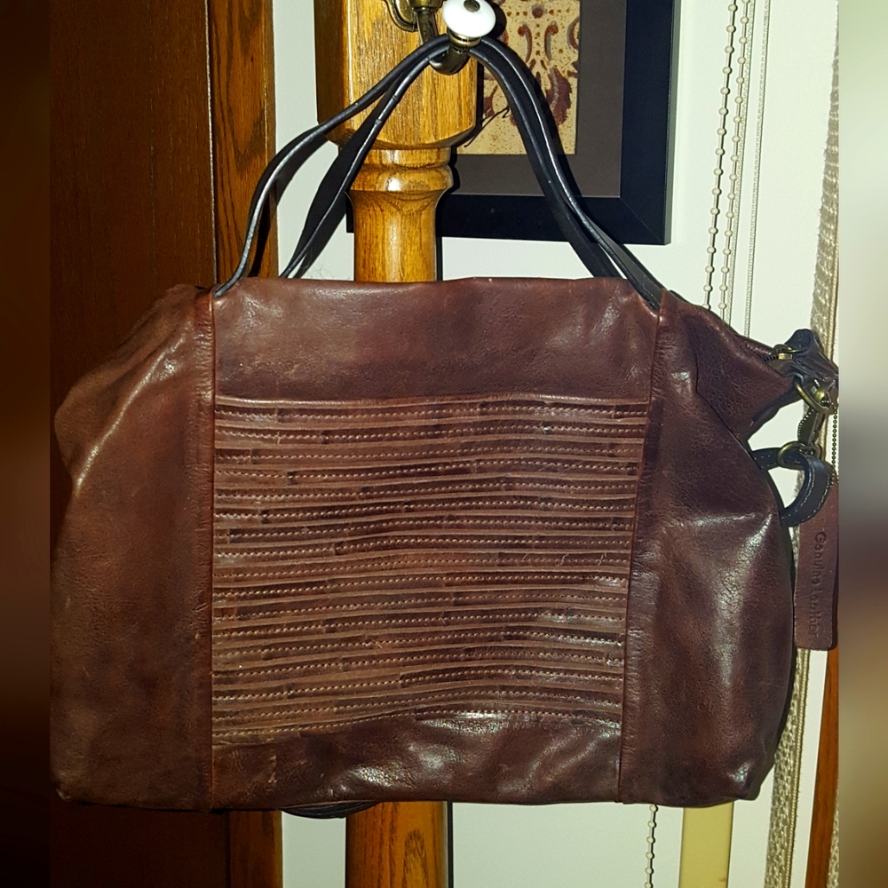 Brown Nino Bossi genuine leather satchel.